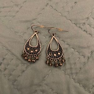 Silver hanging earrings.